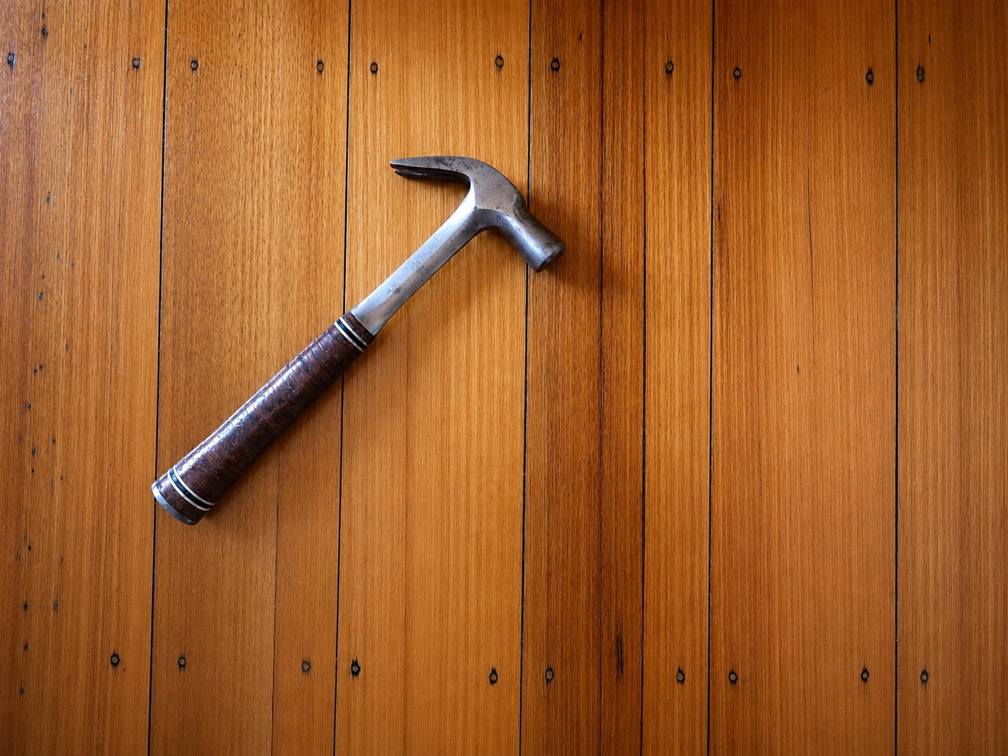 Handyman's hammer on a timber floor